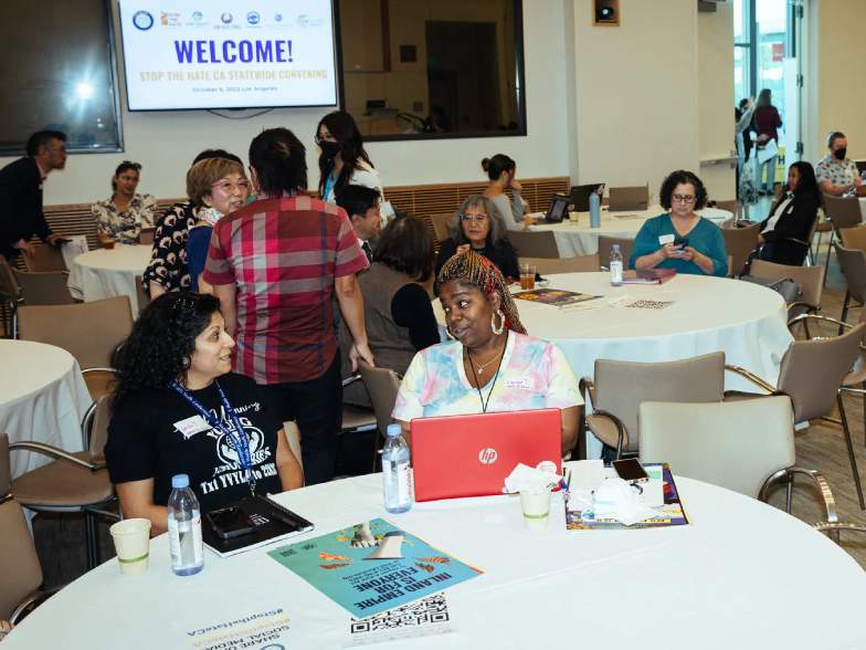 Pictured: Participants seated at their tables during the first ever Stop the Hate convening in Los Angeles